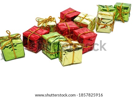 Multicolor gift box isolated on red color background