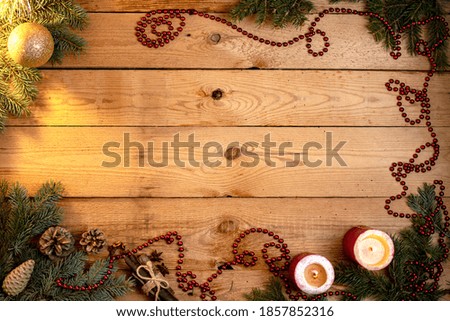 New Year, Christmas background with a place for the inscription tree, green branches of a Christmas tree, tinsel, ball, candle decoration