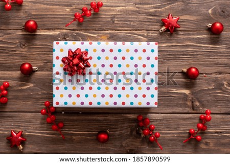 Christmas wooden background with red christmas tree toys and balls.