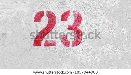 RED Number 23 on the white wall. Spray paint.