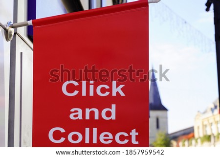 Click and Collect sign on shop street order shopping online and collect from a local store for free