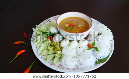 Rice noodles with snakehead fish sauce with ingredients Authentic, very delicious traditional Thai food.  