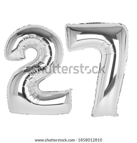 Silver foil balloons with numbers on a white background