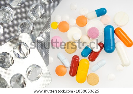 Capsules with vitamin packed insulated on white background