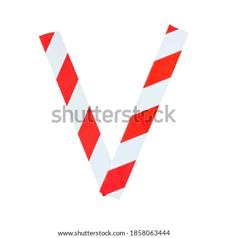 Letter V from red and white warning tape. Isolated on white background