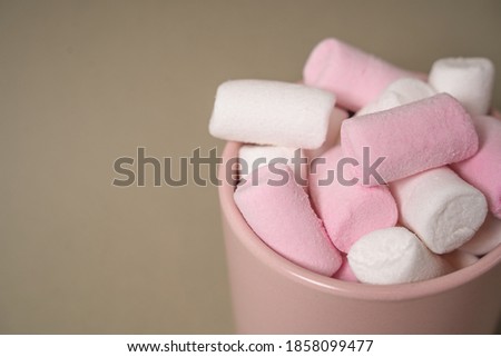 Pink cocoa glass filled with pink marshmallows