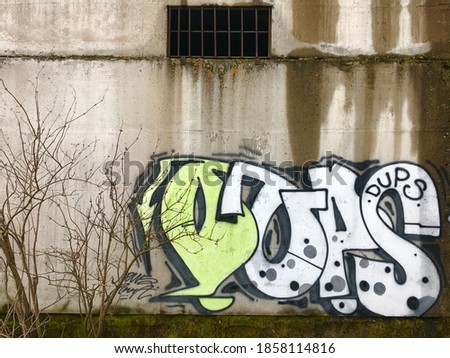 graffiti font in an abandoned ghetto on a concrete wall