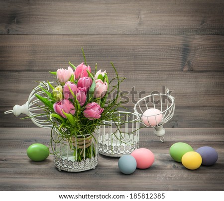 pastel pink tulip flowers and easter eggs. retro style colored picture
