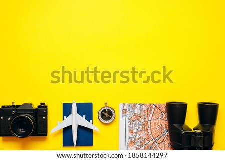 Important things for the traveler are laid out on a yellow, bright background. High quality photo