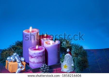 Close up view of Christmas burning candles and decoration objects. Postcard. Christmas and New Year holidays concept background.