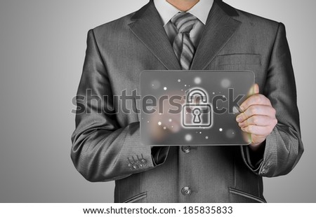 Businessman pushing virtual security button