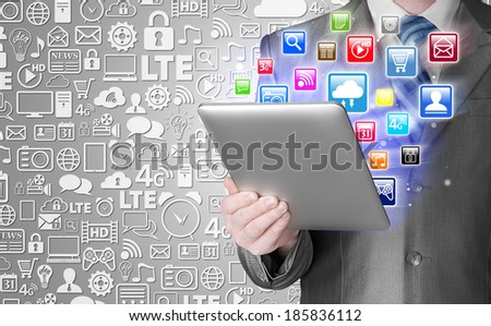 Business man use tablet pc with colorful application icons
