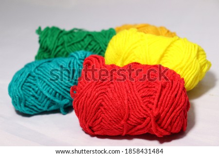 multiple colored yarn stock on white background