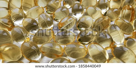 Vitamin D3 capsules. Natural OMEGA-3. A close-up photograph.