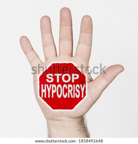 Medicine concept. On the palm of the hand there is a stop sign with the inscription - STOP HYPOCRISY. Isolated on white background.