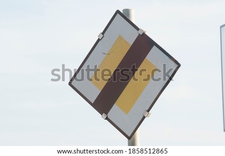a give way or yield traffic sign on the street