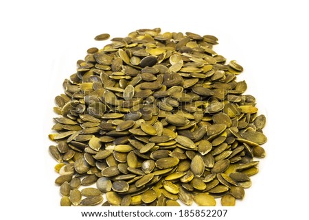 Photo peeled pumpkin seeds, isolated on a white background.