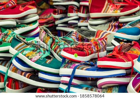 Argentina - colorful shoes for sale at market in Tilcara Royalty-Free Stock Photo #1858578064