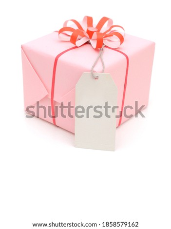 Wrapped gift box with paper tag
