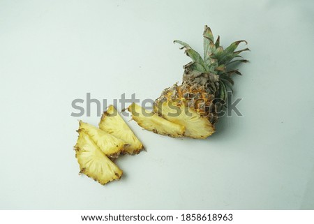 View of fresh pineapple slices isolated on white background. Selective focus. Taking pictures of fruit in a photo studio.