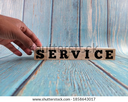 Wooden blocks letter alphabet "SERVICE". Service concept.