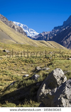 landscape of a valley between mountains
