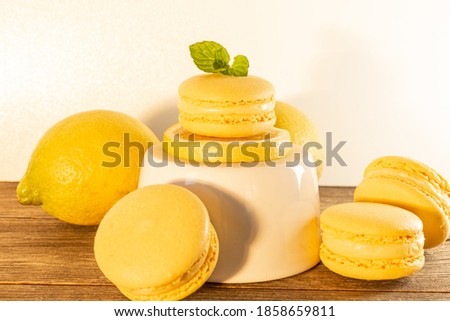 yellow lemon macarons on white background