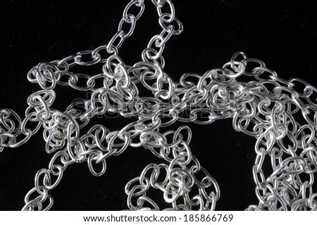 Silver Small Chain Texture on a Black Background