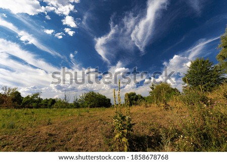 Clouds against blue sky on windy autumn day