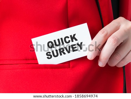 Businessman puts a card with text QUICK SURVEY in his pocket, business concept