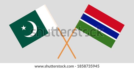 Crossed flags of Pakistan and the Gambia