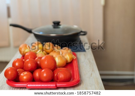 Tomatoes. Culinary background with selective focus and blurred background.