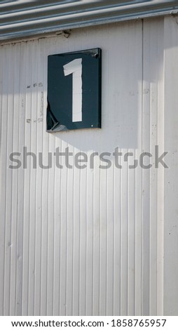 Number one sign in a industrial building door