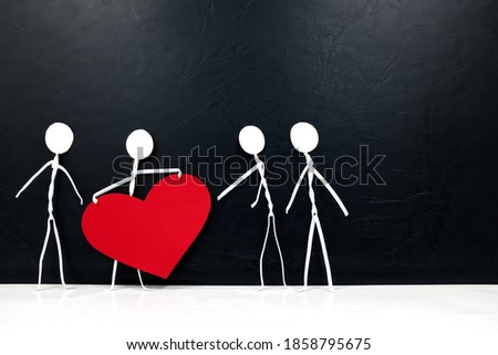 Stick man holding big red heart shape while giving to other people. Share love and kindness, give hope, helping others concept.	