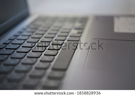 Laptop keyboard photos with selective focus on buttons and blurred background