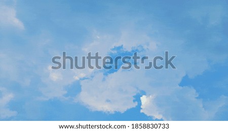 Blurred blue sky and clouds background for natural background design.