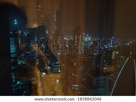 A picture of Dubai downtown taken behind a glass window, Out of focus glass window picture, Silhouette picture