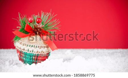 Christmas tree ornament on red background