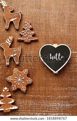 Set of cute gingerbread cookies for Christmas on wooden table 