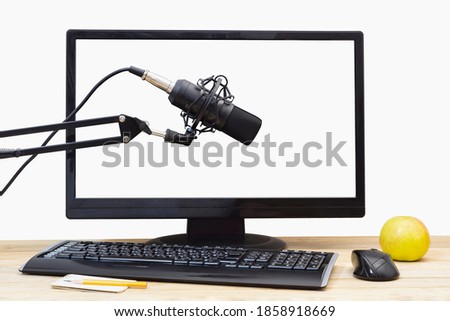 Studio microphone on the background of computer controls