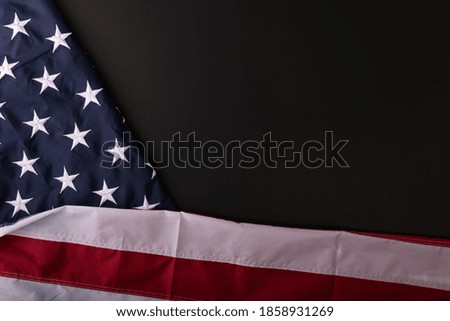American flag on dark background with copy space. American Culture. Top View.