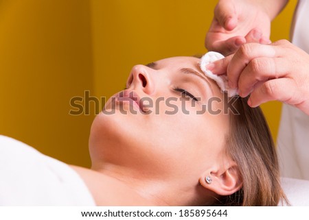 Woman is having cosmetic treatment at beauty salon. Royalty-Free Stock Photo #185895644
