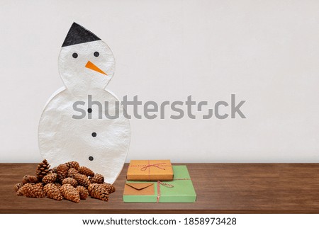 front view snowman night lamp on wooden table
