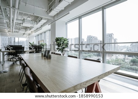 Interior of modern empty office building.Open white ceiling design with wooden floor.
