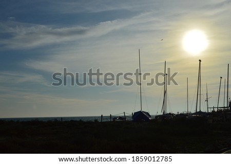 Sunset on the beach with boats