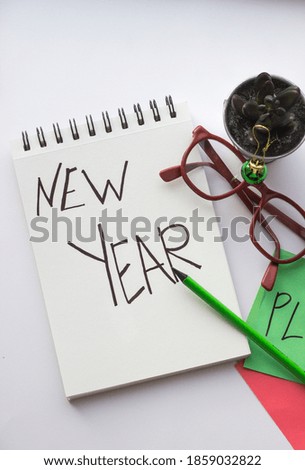 in a white Notepad text new year on a white background