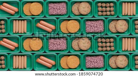 pattern of green trays with vegetarian meat substitute products, plant based mock meat Royalty-Free Stock Photo #1859074720