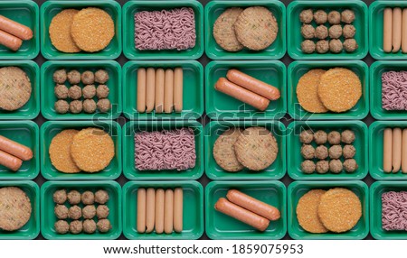 pattern of green trays with vegetarian meat substitute products, plant based mock meat Royalty-Free Stock Photo #1859075953