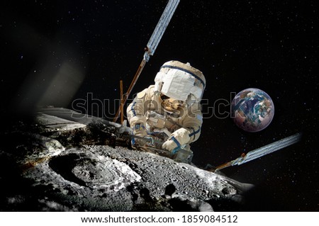 Astronaut repairman repairs something on the moon surface, and the planet Earth behind him on a starry sky. Collage, elements of this image furnished by NASA.