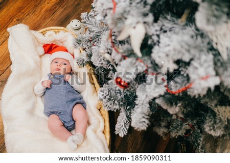 Picture of small boy lies in a New Year's cap